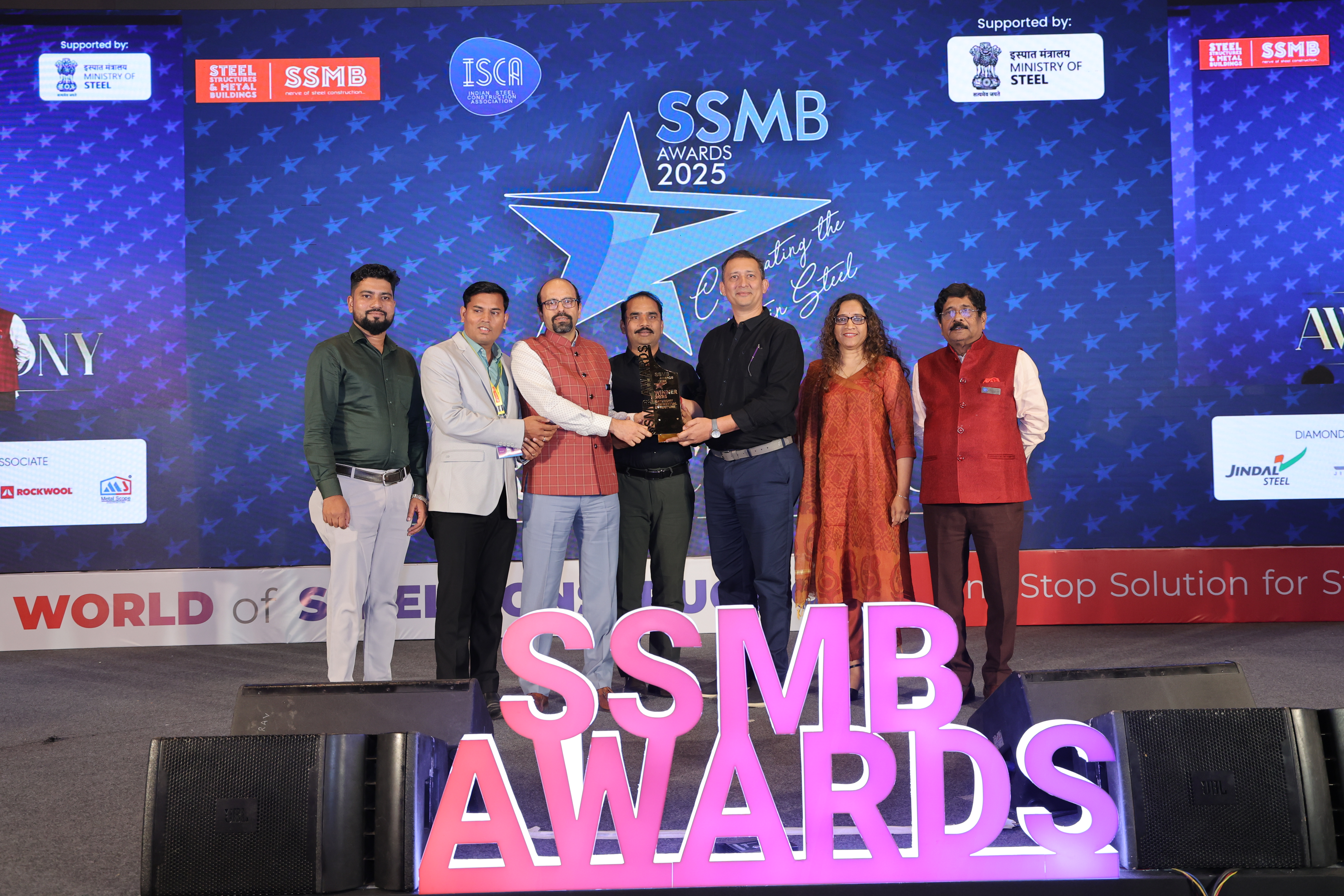 Winners receiving trophy