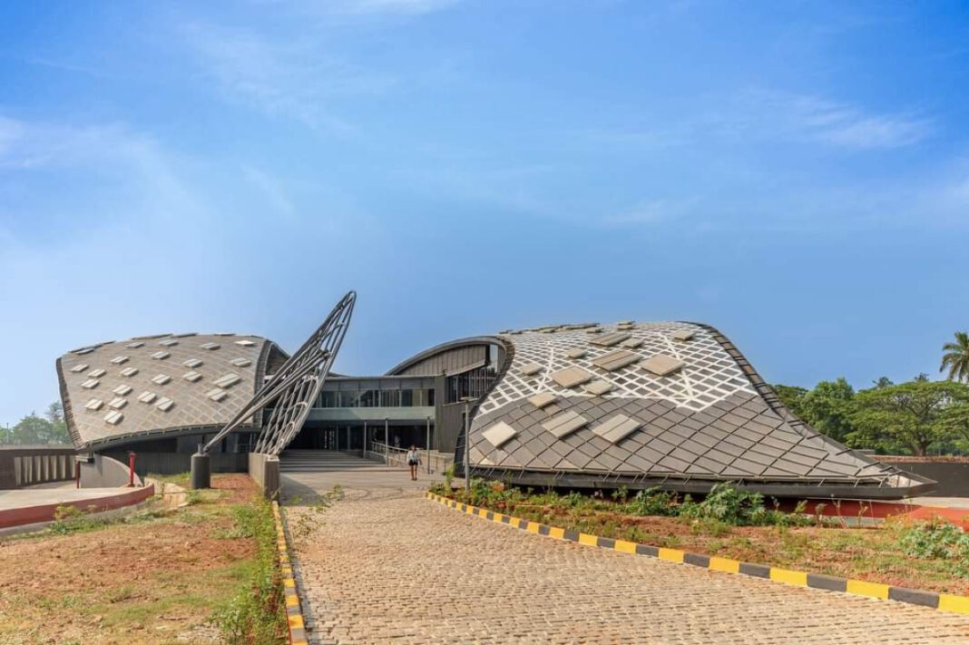National Institute of Watersports (NIWS), Goa, Southeast Asia, water sports institute,double-curved steel roof, seismic-resistant design, lightweight structure, composite structure, aluminium sections, corten steel panels, perforated steel sunscreen, parametric grid roofs, grid shell structure, trapezoidal panels, structural innovation, fabrication challenges, engineering resilience, M:OFA Studios, DELF Consulting Engineers, Jade Consultants, Ramjidas Constructions