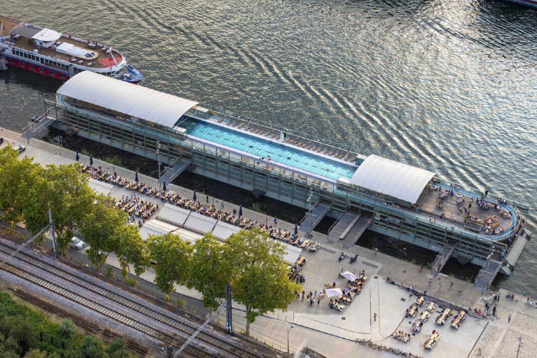 1_Annette K_ A Revitalizing Hub for Health and Well-Being in Paris Annette K, Sports Health Well-Being Center, Seine River, Paris, architectural gem, historic revitalization, contemporary design, multi-functional complex, Olympic-length swimming pool, accessibility, steel, glass, Nordic pool concept, sustainability