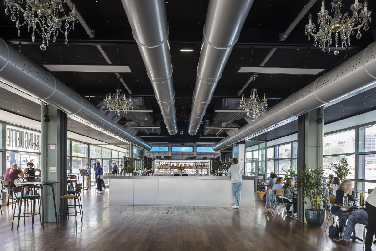 Annette K, Sports Health Well-Being Center, Seine River, Paris, architectural gem, historic revitalization, contemporary design, multi-functional complex, Olympic-length swimming pool, accessibility, steel, glass, Nordic pool concept, sustainability