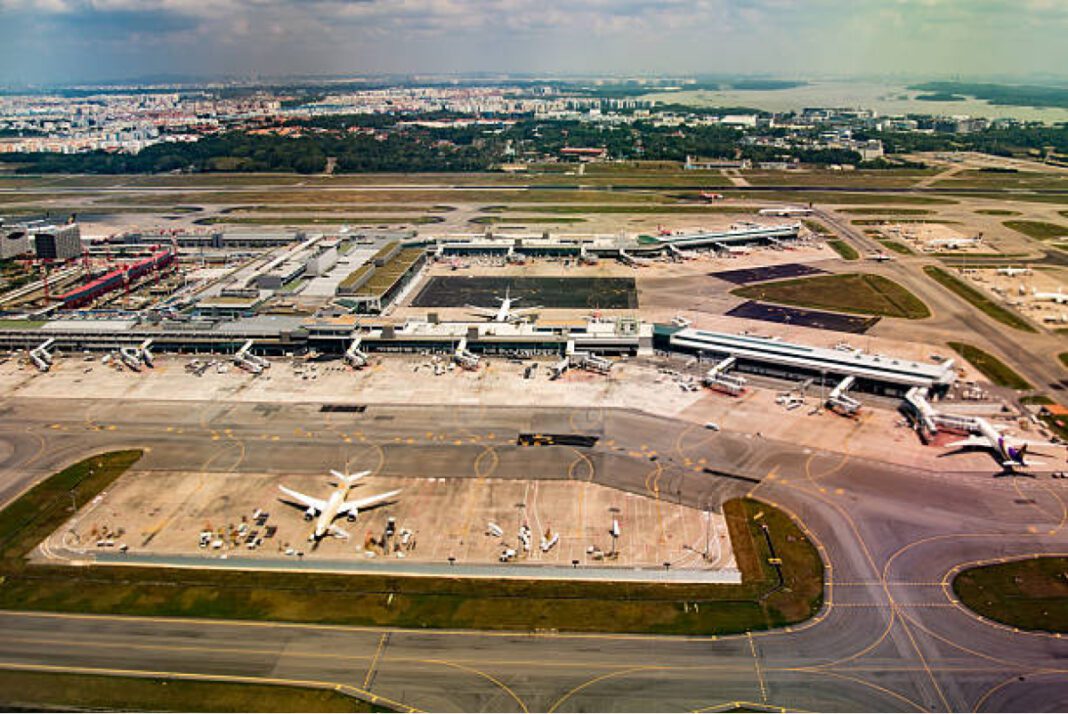 Singapore Changi Airport aerial view Supreme Court, Gaggal Airport, expansion approval, Himachal Pradesh, connectivity, land acquisition, infrastructure development, economic growth, regional development.