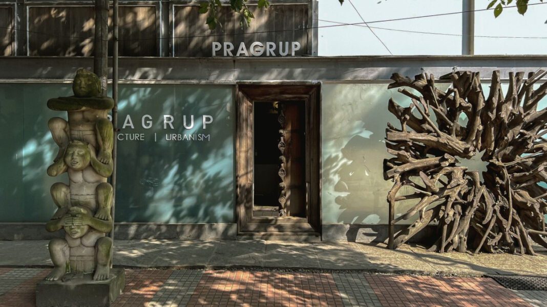 Pragrup Studio, Bengaluru, sustainable architecture, cultural hub, heritage preservation, material reuse, recycled steel, timber, creative spaces, multi-functional design, green building, urban design, flexible workspaces, rainwater harvesting, solar panels, rooftop amphitheatre, community engagement, adaptive reuse, office and cultural space.