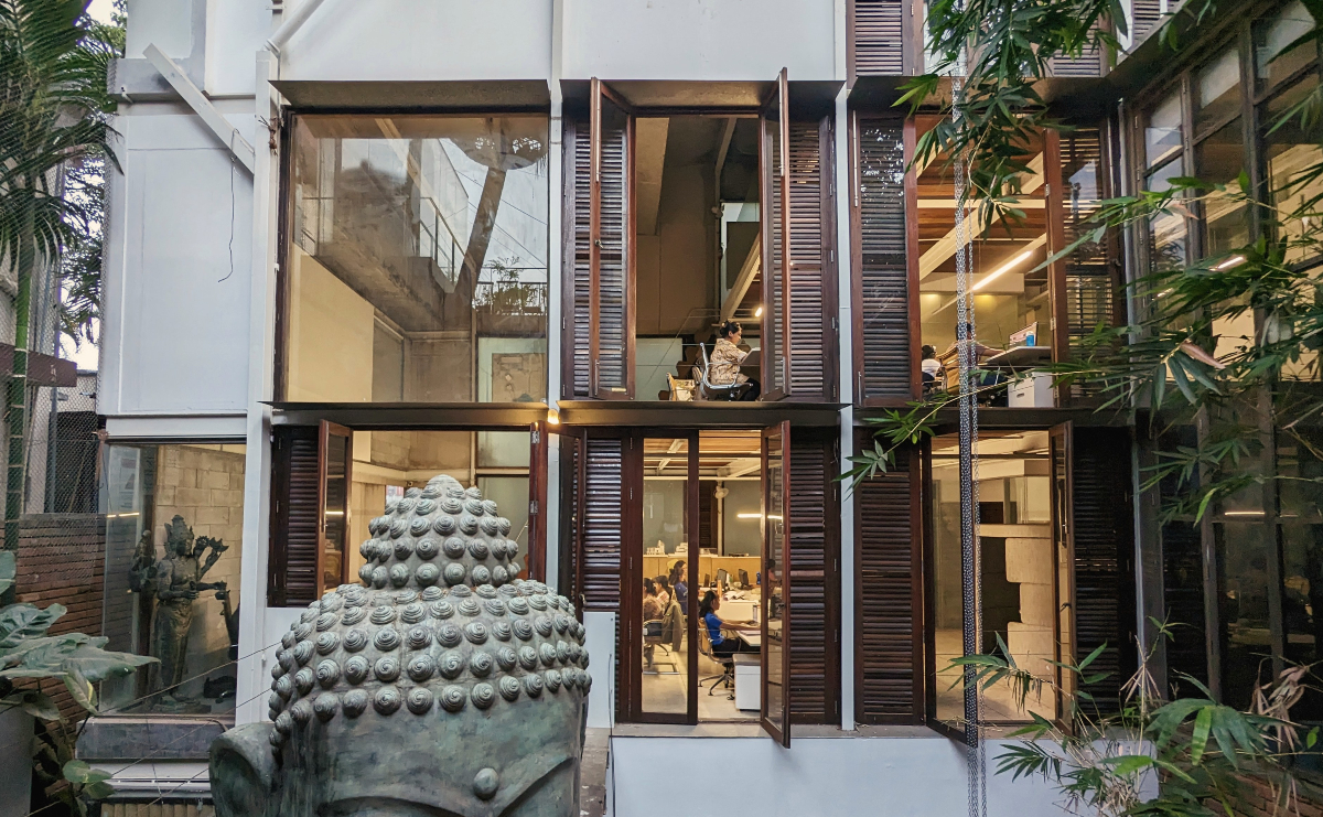 Pragrup Studio, Bengaluru, sustainable architecture, cultural hub, heritage preservation, material reuse, recycled steel, timber, creative spaces, multi-functional design, green building, urban design, flexible workspaces, rainwater harvesting, solar panels, rooftop amphitheatre, community engagement, adaptive reuse, office and cultural space.