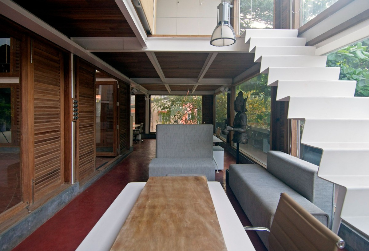 Pragrup Studio, Bengaluru, sustainable architecture, cultural hub, heritage preservation, material reuse, recycled steel, timber, creative spaces, multi-functional design, green building, urban design, flexible workspaces, rainwater harvesting, solar panels, rooftop amphitheatre, community engagement, adaptive reuse, office and cultural space.