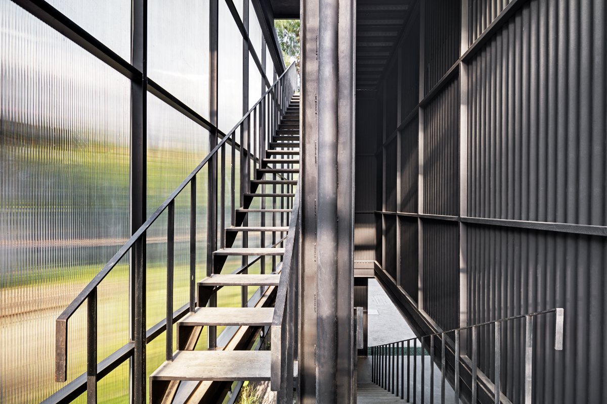 The Courtyard, Bengaluru, M9 Design Studio, steel, polycarbonate, sustainable architecture, prefabrication, light-box effect, modular design, urban landmark, event space, modern architecture, innovative design, industrial materials, natural light, steel structure, eco-friendly design.
