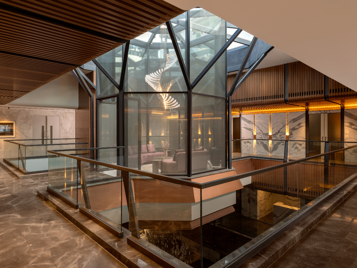 Steel exoskeleton, sustainable architecture, innovative design, modern workspace, Noida corporate office, 42mm Architecture, structural engineering, advanced construction, green terraces, architectural innovation, APL Apollo.
