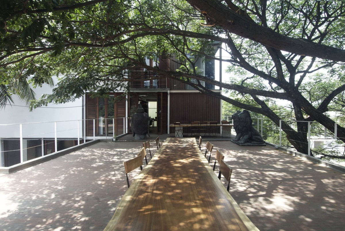 Pragrup Studio, Bengaluru, sustainable architecture, cultural hub, heritage preservation, material reuse, recycled steel, timber, creative spaces, multi-functional design, green building, urban design, flexible workspaces, rainwater harvesting, solar panels, rooftop amphitheatre, community engagement, adaptive reuse, office and cultural space.