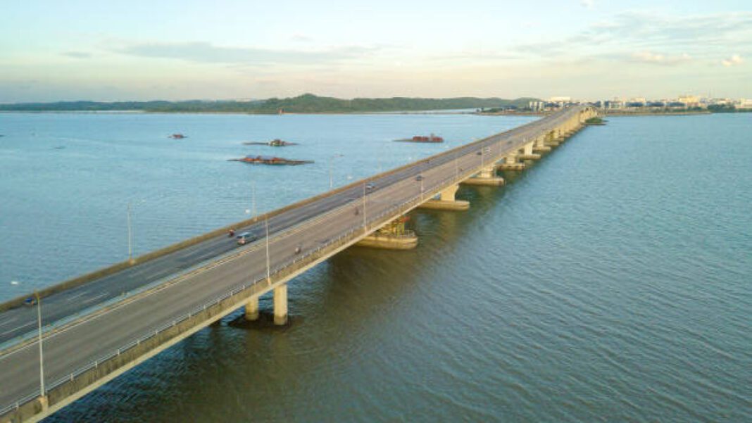 Drone point of view of Johor bridge near Singapore in Malaysia. BMC, CRZ clearance, Versova-Bhayander, coastal road project,construction clearances, environmental clearance,