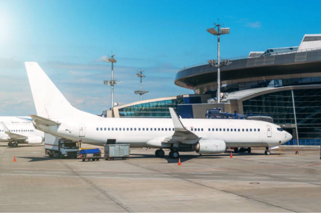 white private jet and open ladder at the airport on a background cloudy sky Maharashtra, Gadchiroli, airport development, connectivity, economic growth, industrial growth, MADC, greenfield airport, Airports Authority of India, infrastructure, regional development, industrial hub