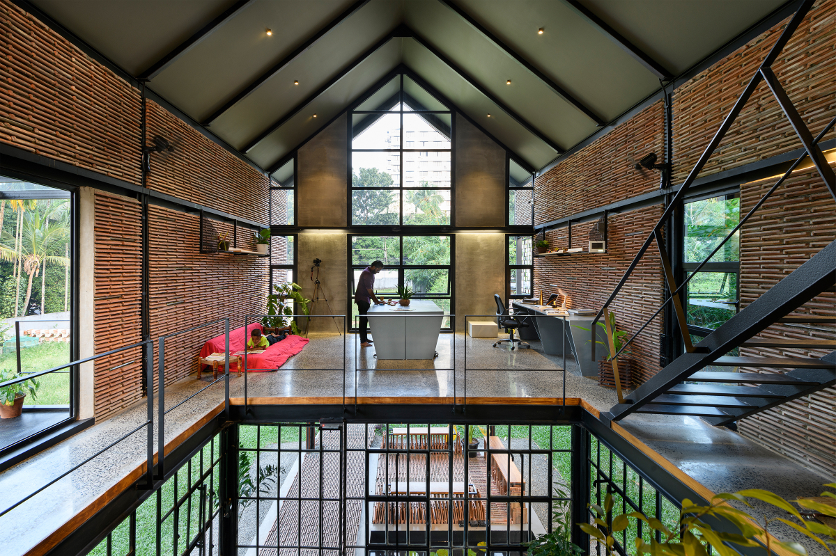 Koshish House, Kochi, sustainability, architectural design, material reuse, terracotta tiles, steel repurposing, creative design, elevated structure, dynamic spatial experience, natural light, local collaboration, eco-friendly construction, modern architecture