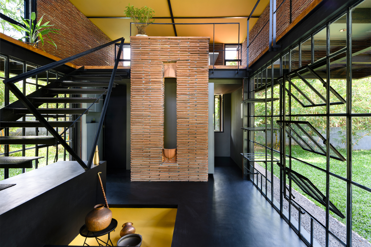 Koshish House, Kochi, sustainability, architectural design, material reuse, terracotta tiles, steel repurposing, creative design, elevated structure, dynamic spatial experience, natural light, local collaboration, eco-friendly construction, modern architecture