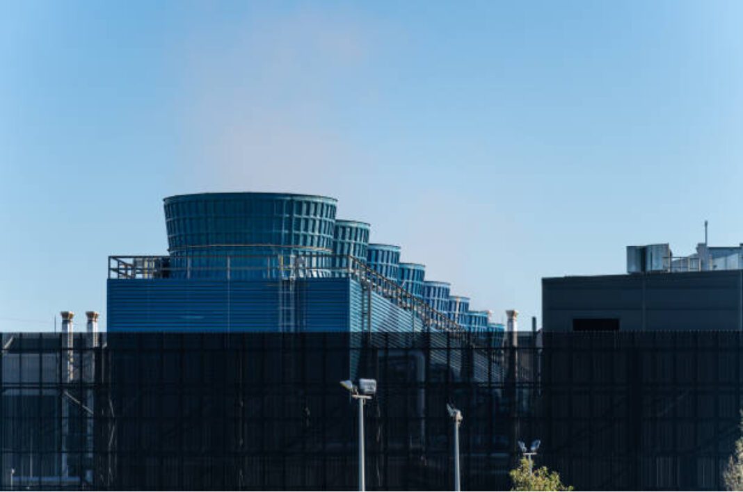 Heat emission from the chimneys of a large data and server complex. Telangana, STT GDC, Hyderabad data centre, AI-ready facility, Meerkhanpet, 100 MW capacity, digital transformation, global tech hub, Telangana Rising, data hub, investment in India