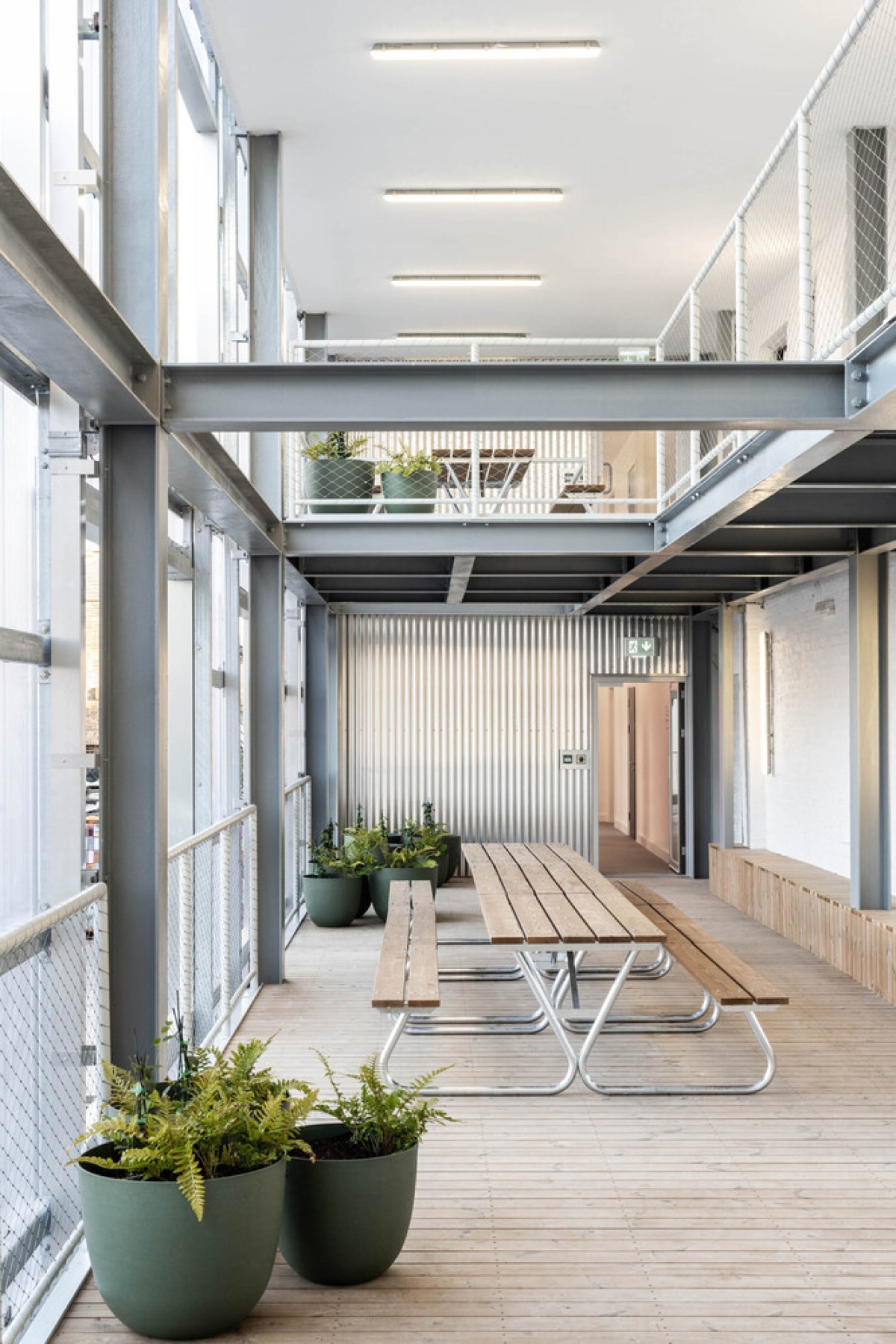 Bradbury Works, Gillett Square, Dalston, refurbished, affordable workspace, flexible spaces, Victorian terrace, collaborative environment, refurbished entrance,polycarbonate facade, reflective, 


