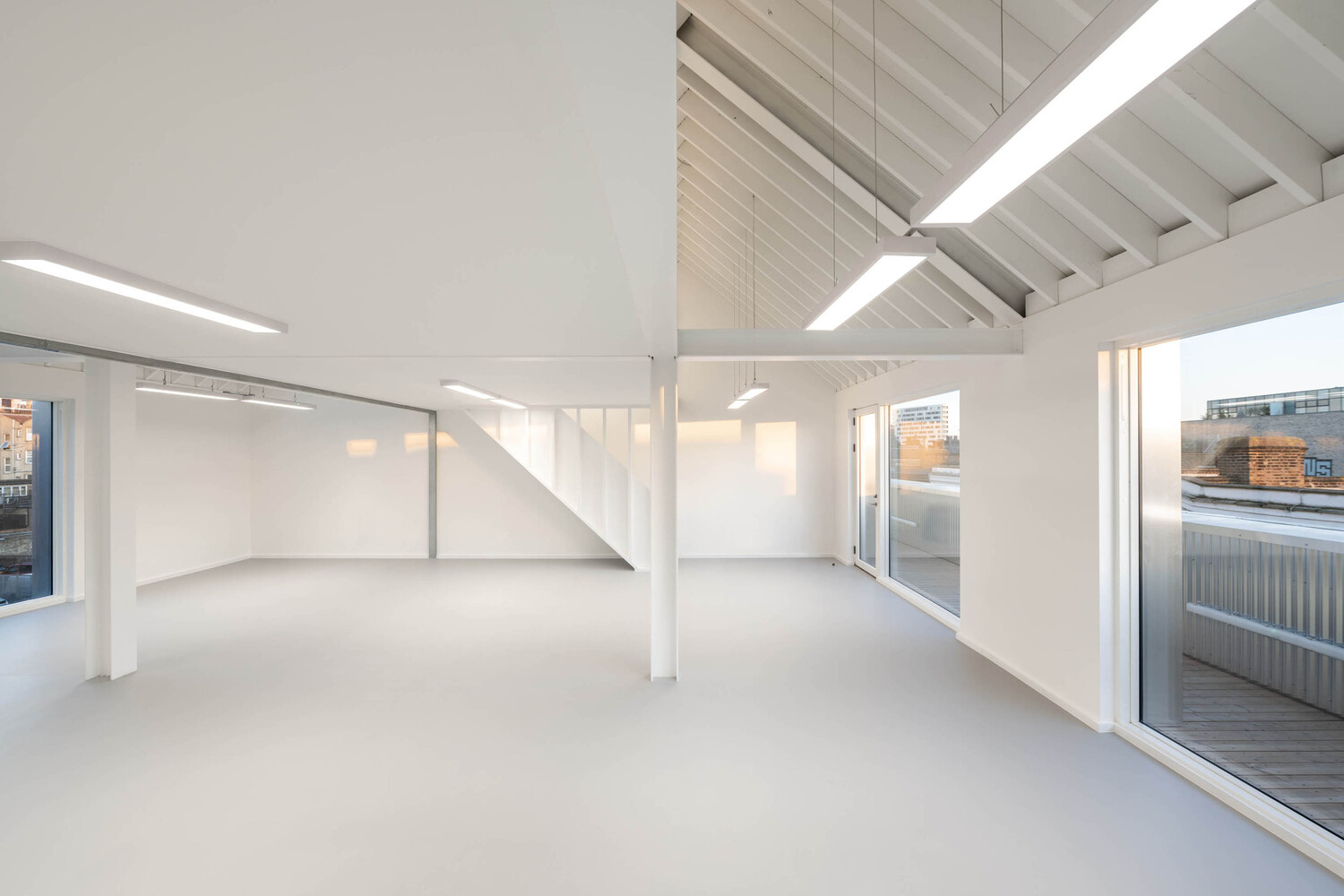 Bradbury Works, Gillett Square, Dalston, refurbished, affordable workspace, flexible spaces, Victorian terrace, collaborative environment, refurbished entrance,polycarbonate facade, reflective, 
