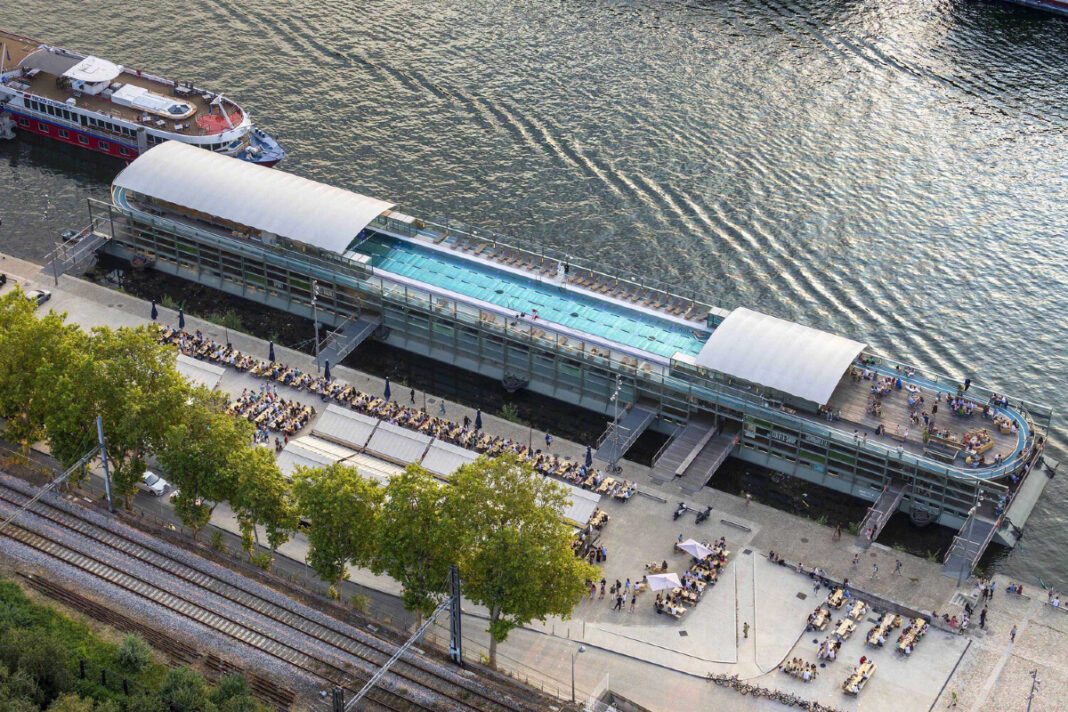 Annette K, Sports Health Well-Being Center, Seine River, Paris, architectural gem, historic revitalization, contemporary design, multi-functional complex, Olympic-length swimming pool, accessibility, steel, glass, Nordic pool concept, sustainability