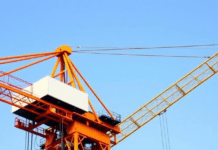 Cranes and Industrial Ropes Market Growth: Segments, Trends, and Opportunities Construction crane lifting heavy loads with industrial ropes, symbolizing market expansion and technological advancements